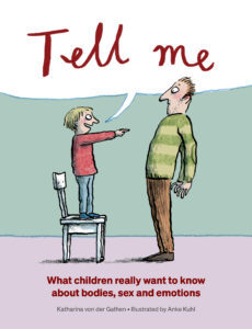 Cover for Tell Me of a young child standing on a chair, pointing at an adult male and cheerfully saying 'tell me'